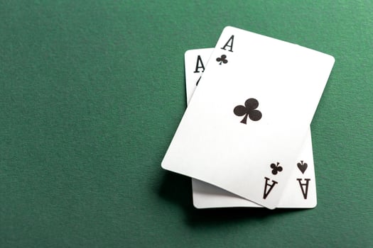 Cards and chips for poker on green table photo