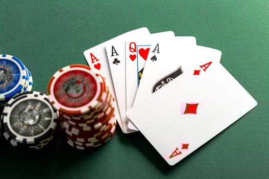 Cards and chips for poker on green table photo