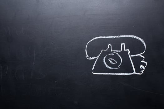 Wireless Symbol Drawn on a Blackboard near smartphone photo