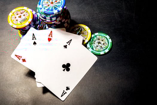 poker chips and cards on black background photo