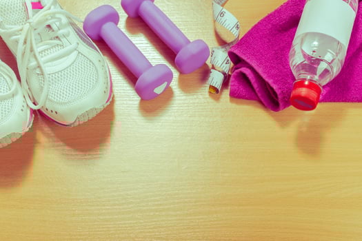 Shoes and sports equipment on wooden floor, top view photo