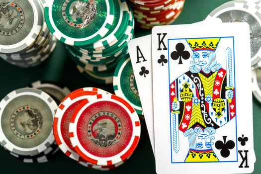 Cards and chips for poker on green table photo