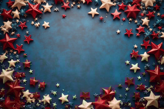 Decorative stars in red, white, and blue arranged on a blue background for a festive celebration photo