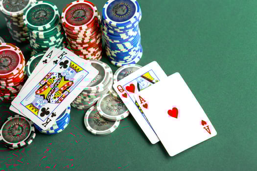 Cards and chips for poker on green table photo