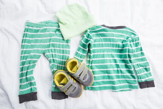 Baby boy clothes on white background photo