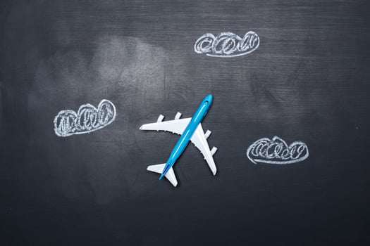 toy airplane over chalkboard background and arrows drawings photo