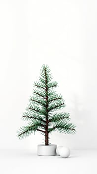 small evergreen tree two white spheres on a white pedestal photo