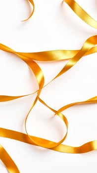 golden ribbon curled on a white background photo