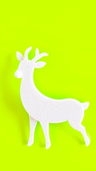 white deer silhouette on neon green photo