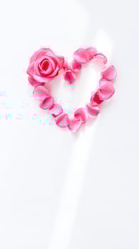 pink rose forming a heart shape photo