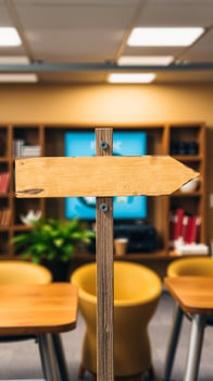 blank wooden arrow sign a room with bookshelves photo