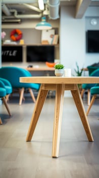 wooden table with teal chairs an office setting photo