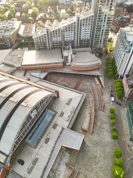 Aerial View of Greater Manchester City Centre and Tall Buildings During Golden Hour of Sunset. England UK. May 5th, 2024, High Angle Footage Was Captured with Drone's Camera photo