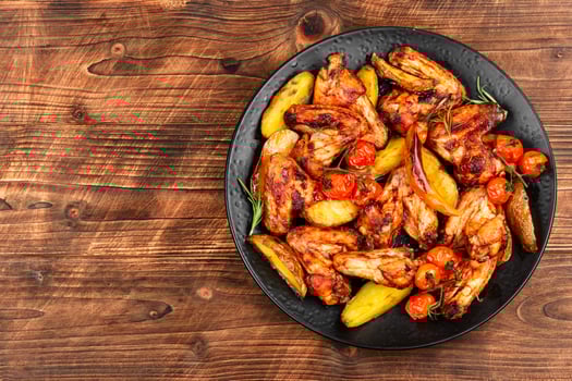 Spicy baked chicken wings. photo