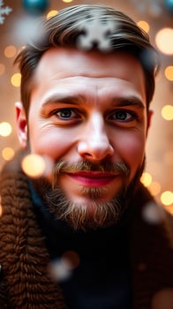 man with a beard smiles warmly at the camera photo