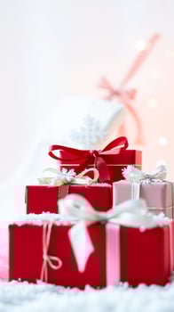 stack festive gift boxes adorned with ribbons photo