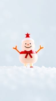 plastic snowman figurine with a red bow star photo