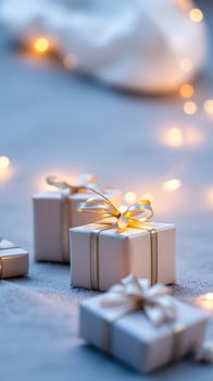 white gift boxes with golden ribbons warm lights photo