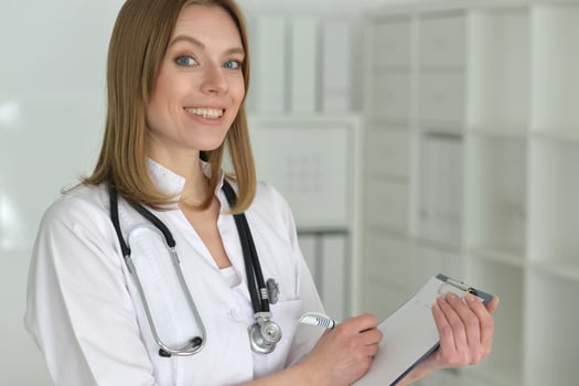 Young female doctor posing in the office photo