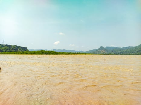 A man standing on a raft in a river photo