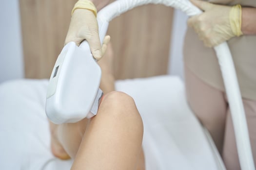 Professional laser hair removal treatment in modern beauty clinic for smooth skin care. photo