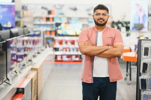 Indian man in an electronics store photo