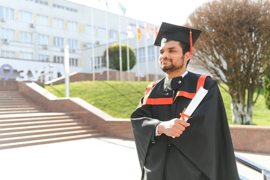 education, graduation and people concept - happy Indian Male graduate student photo