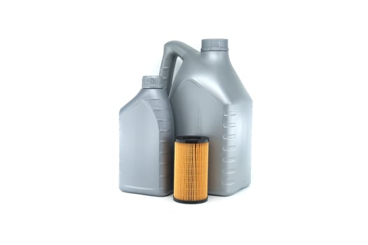 Automotive oil containers and filters isolated on white background photo