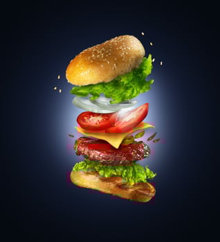 Burger with lots of vegetable and cheese wallpaper photo
