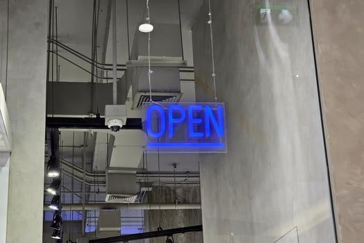 Open Sign Hanging from the Ceiling. photo