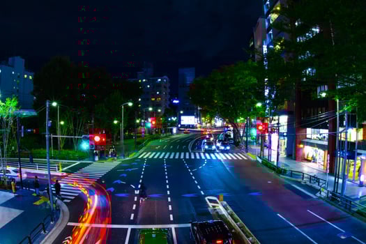 A night neon street in Shibuya wide shot photo