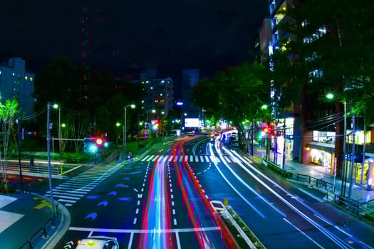 A night neon street in Shibuya wide shot photo