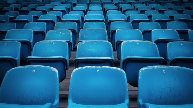 Blue stadium seats arranged in rows at a sports venue ready for upcoming event photo