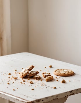 A table with a cookie and a half eaten one photo