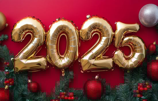 Bright golden balloons spell out 2025 surrounded by festive holiday decorations on a red background photo