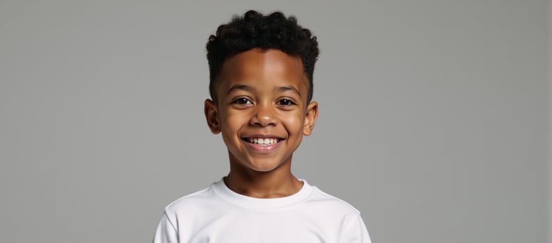 African American Boy with Curly Hair Wearing White TShirt Mockup Grey Background photo