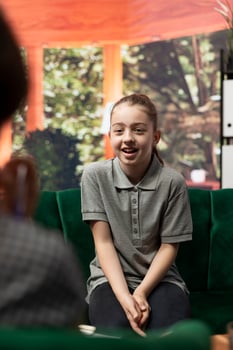 Psychologist listens to girl at counseling session dealing with anxiety, trying to overcome intrusive thoughts and low confidence. Therapist helps her manage behavioral issues. photo
