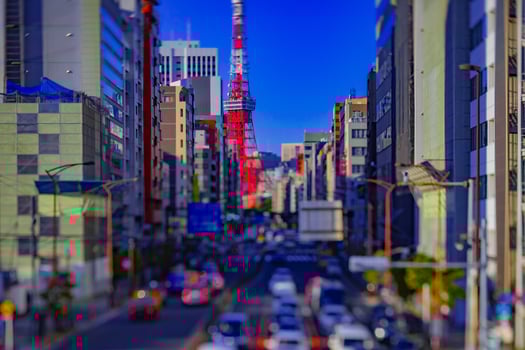 A miniature traffic at the urban street behind Tokyo tower tiltshift photo
