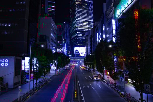 A night urban city street in Shibuya Tokyo wide shot photo