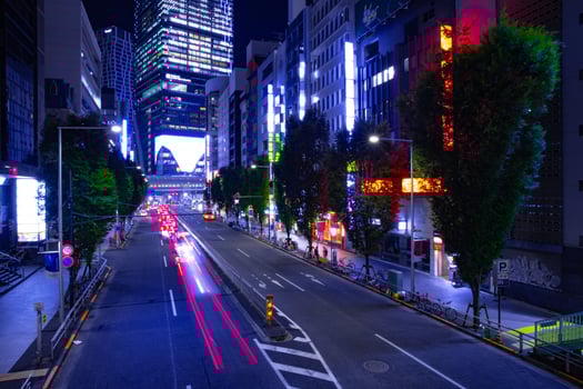 A night urban city street in Shibuya Tokyo wide shot photo