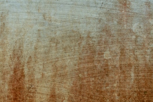 Texture of brick wall with worn white plaster, dull brick wall, reddish brown spots, dirty wall with clay photo
