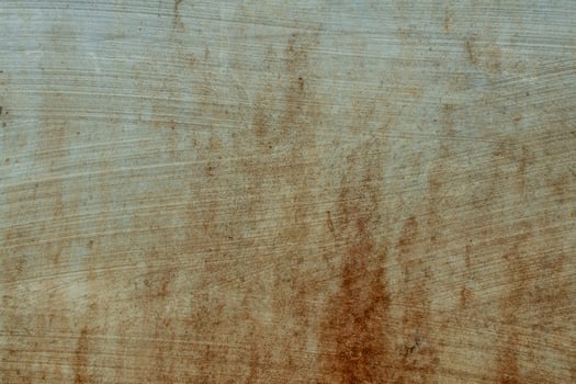 Texture of brick wall with worn white plaster, dull brick wall, reddish brown spots, dirty wall with clay photo