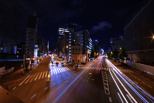 A night urban city street near Tokyo tower in Tokyo wide shot photo