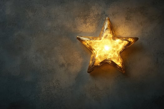 Illuminated Golden Star on Rough Grey Concrete Background photo