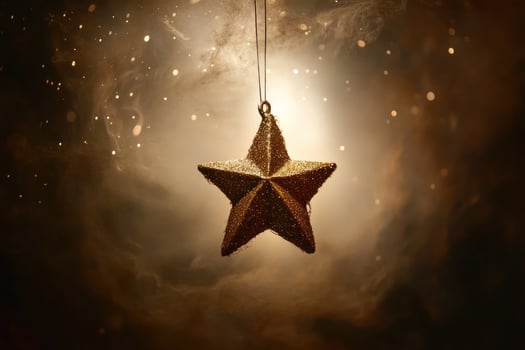 A Shiny Gold Star Ornament Hanging in a Smoky Atmosphere with Sparkling Lights photo