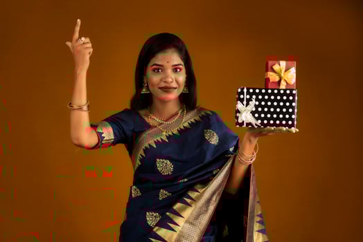 Portrait of young happy smiling woman or Girl holding gift box. photo