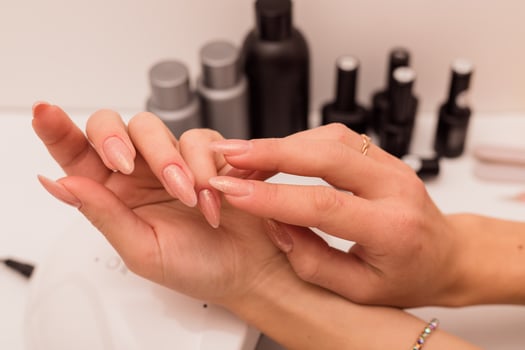 Woman giving herself a manicure photo