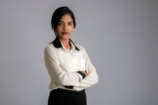 Portrait of a young girl woman posing on gray background photo
