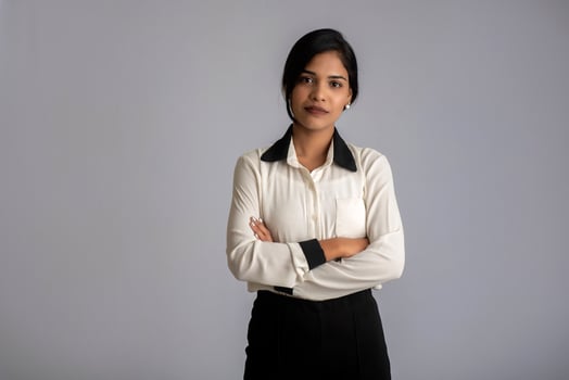 Portrait of a young girl woman posing on gray background photo