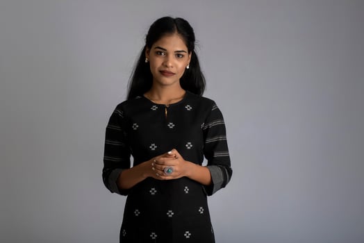 Portrait of a young girl woman posing on gray background photo